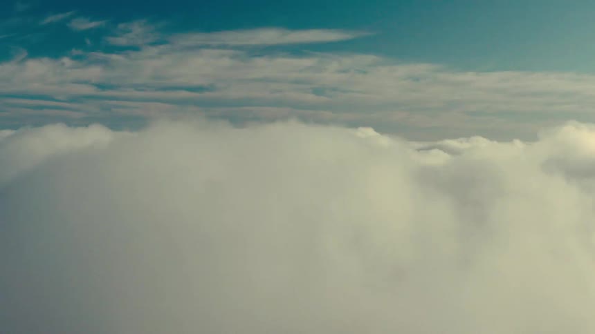 A view of the sky filled with clouds