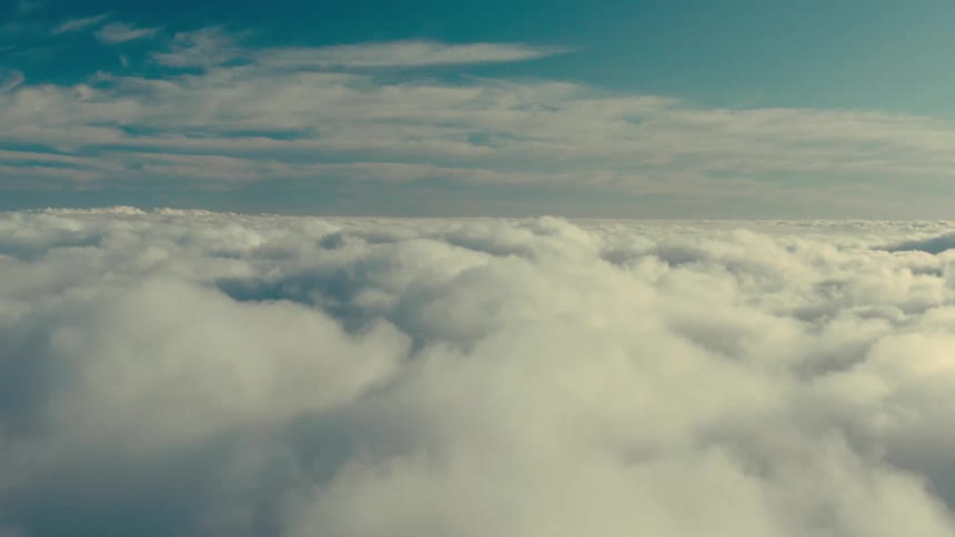 Aerial landscape of a blue sky with dense clouds