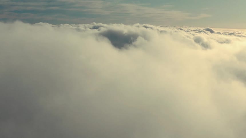 A birds eye view of a sky filled with clouds