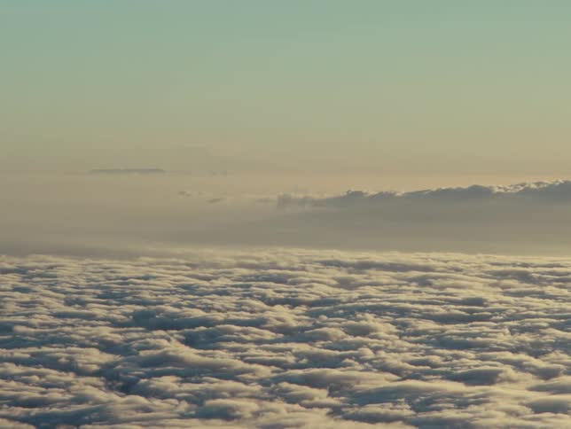 Clear morning sky with cluster of clouds