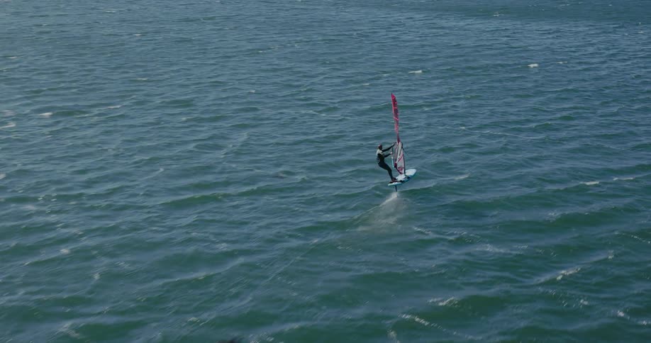 An olympic windsurfer trains for a race