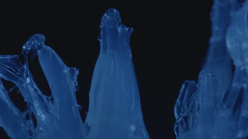 A gel-like blue substance is melting