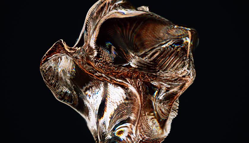 Moving abstract object with golden texture against a black background