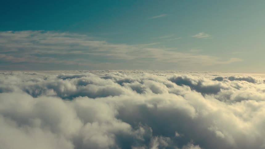 A thick bank of clouds obscuring the ground
