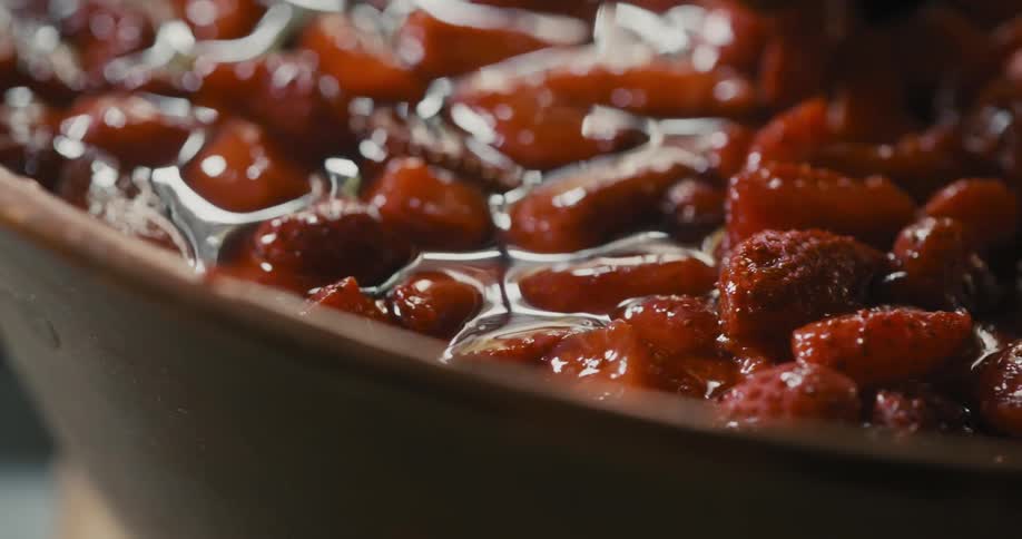 Cook stirs food in a pot while in the kitchen