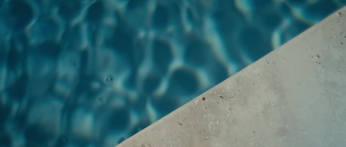 Ripples move in the blue water of the pool