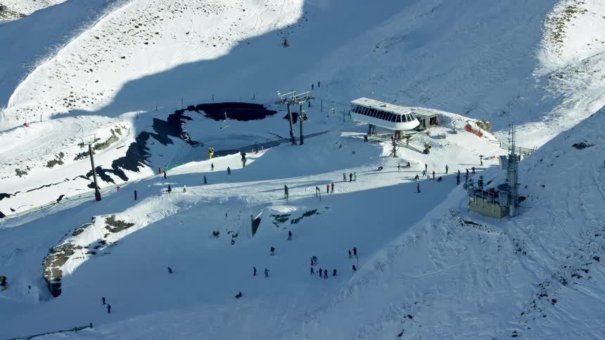 An aerial clip of a ski field chairlift station