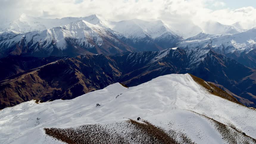 Aerial view of a mountain range ski field  covered in snow