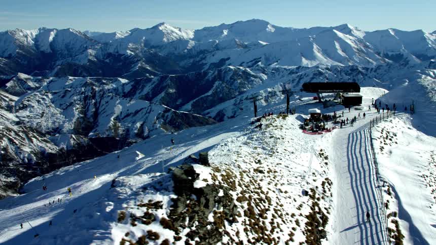 People are skiing on the mountain top