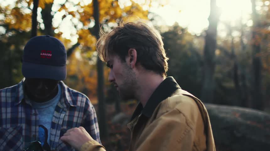 Two professional photographers load film into their camera