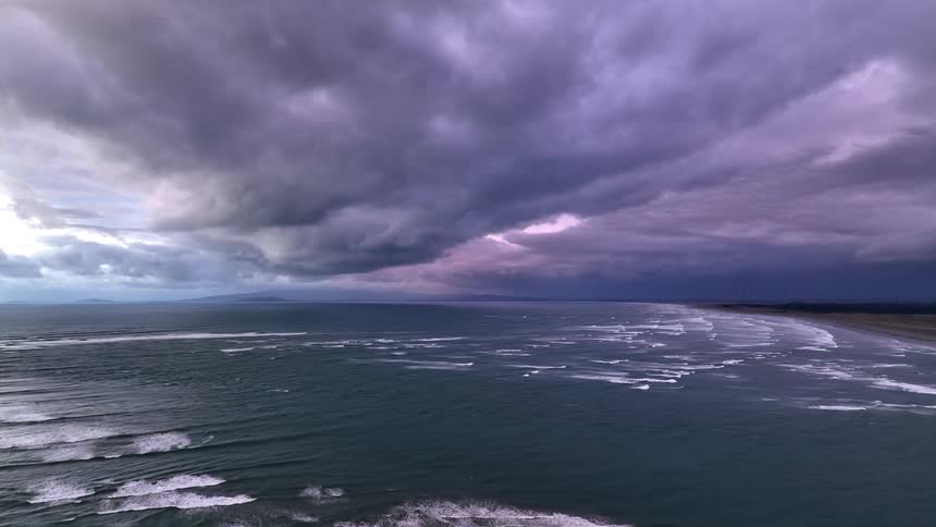 Dramatic coastal landscape under a stormy sky with dark clouds