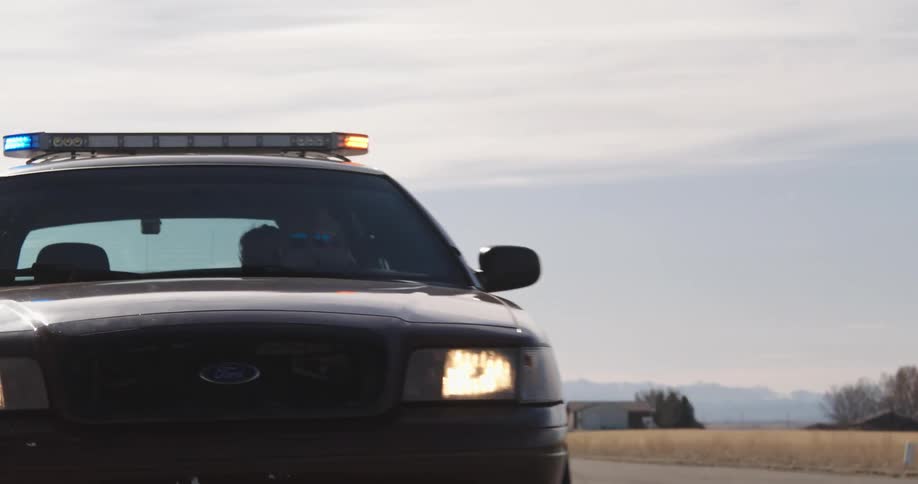 Police vehicle moving on a road