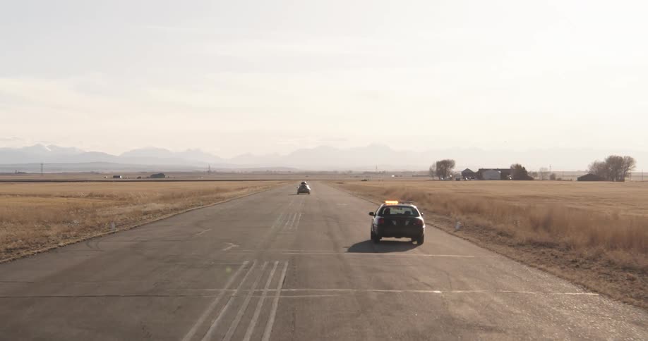 A police car is chasing after a car