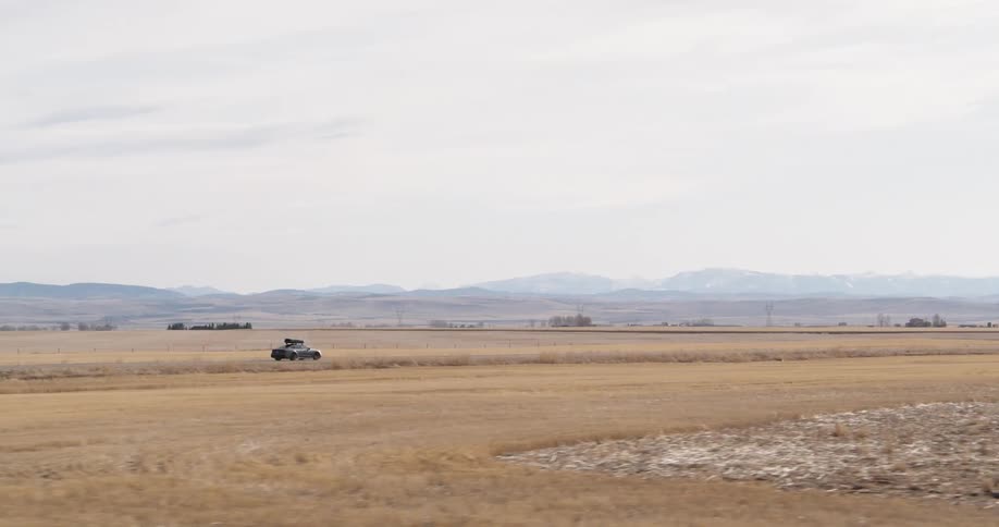 A car is driving off road on the field