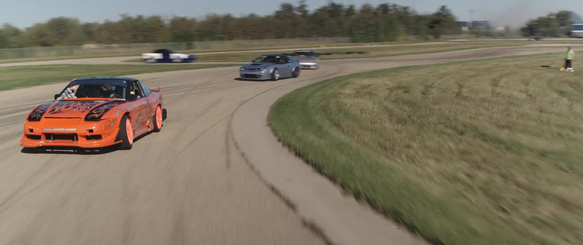 A fleet of cars racing on a track showcasing speed and precision in a thrilling competition