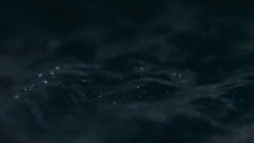 Closeup of water with bubbles and ripples