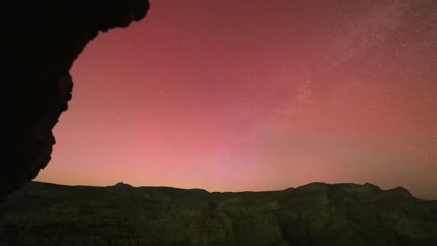Aurora filled night sky in the desert
