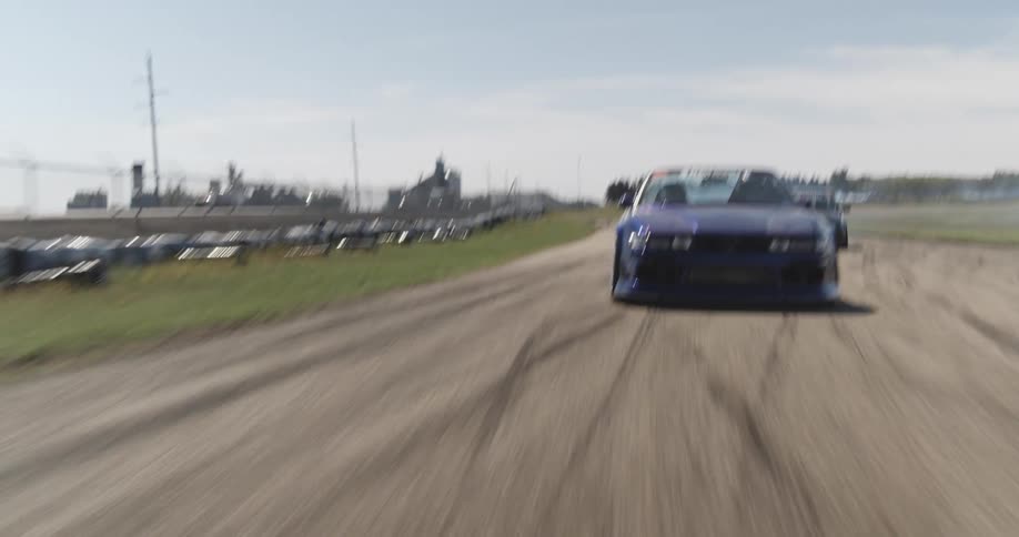 Cars in a tight race on a track