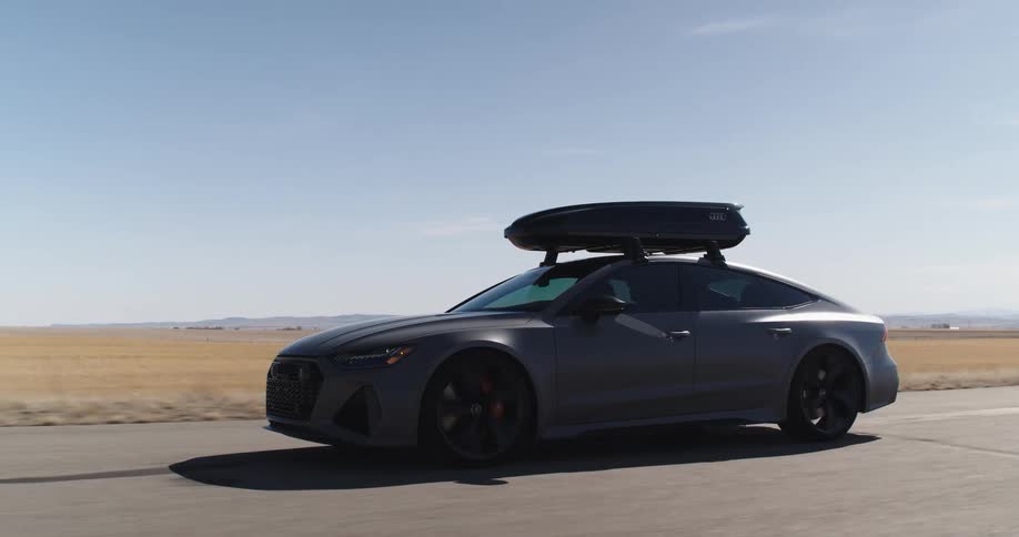 Modern sports car moving on an open road