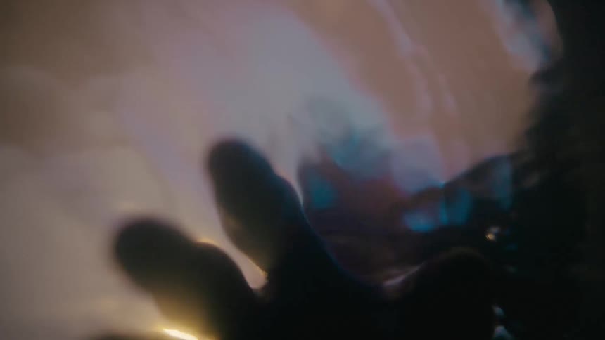 Hand submerged in water