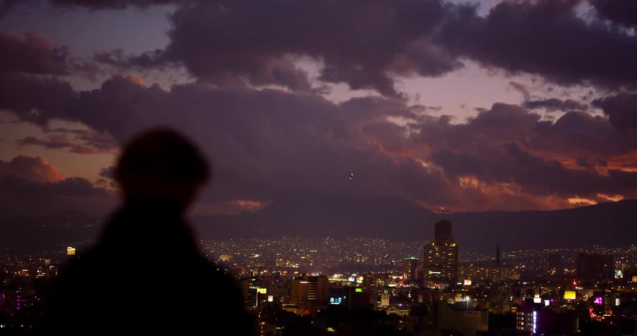 A helicopter flies over the city