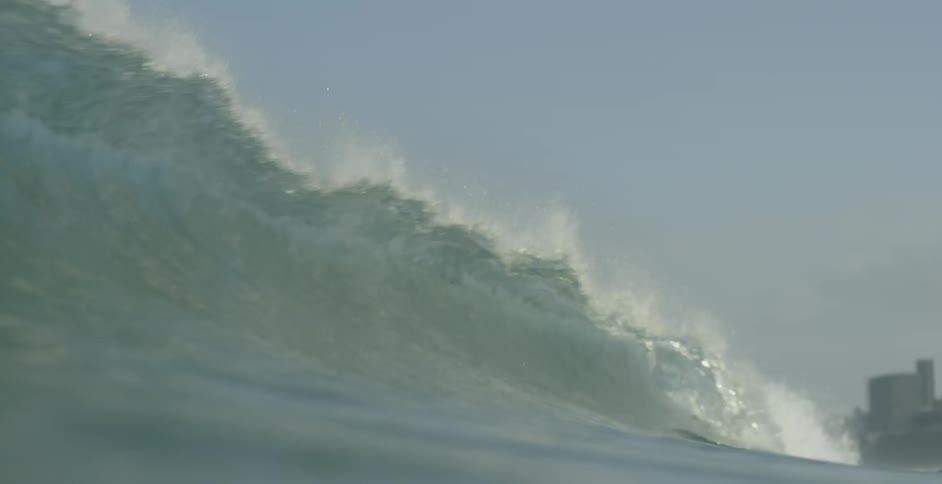 Rolling wave headed to shore as it hits the camera