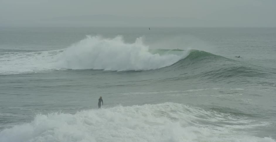 A man surfs in the ocean