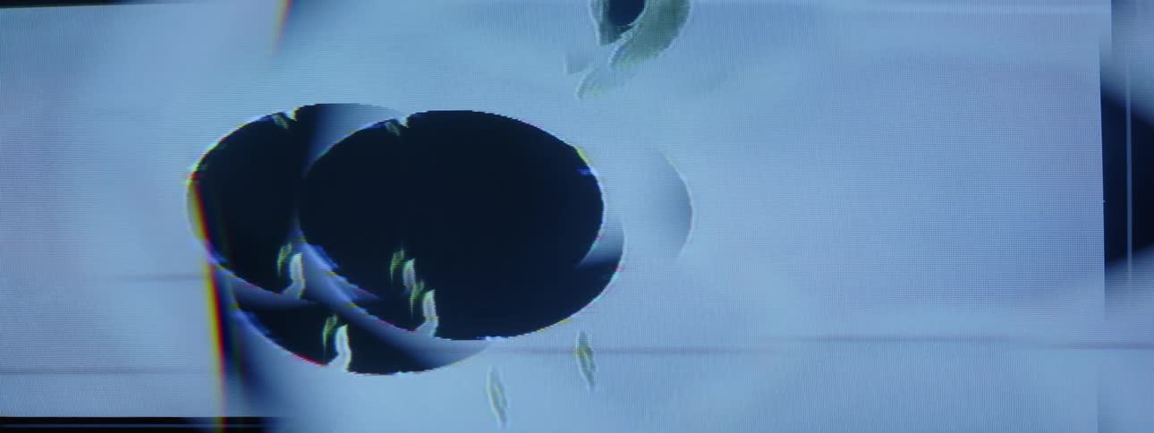 Pale smudges float across dark oval shapes while dark smudges flow through enclosing pale rectangles