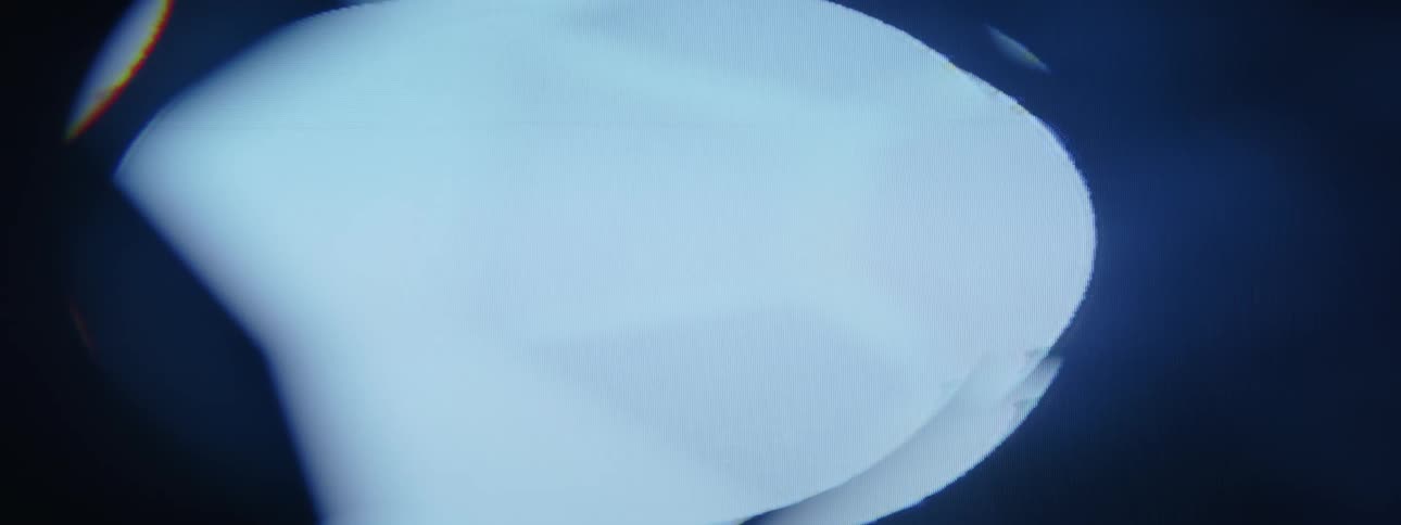 An abstract object of bright blue light with black flickers