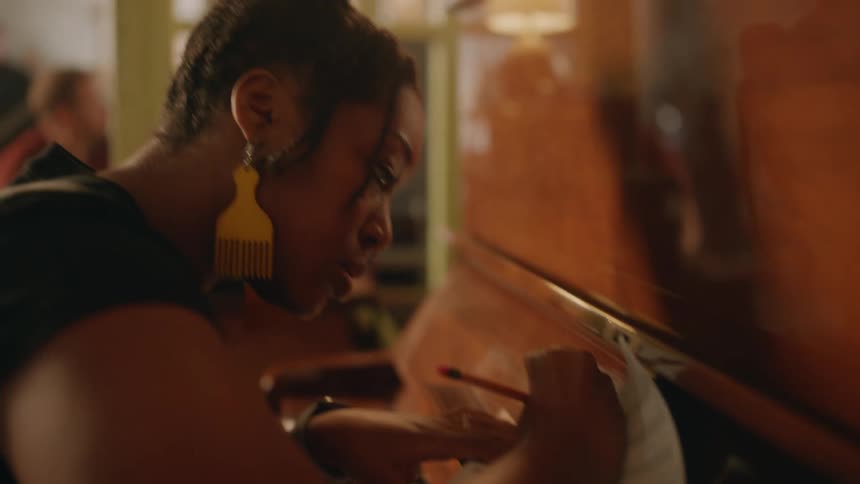 A footage of a musician composing music