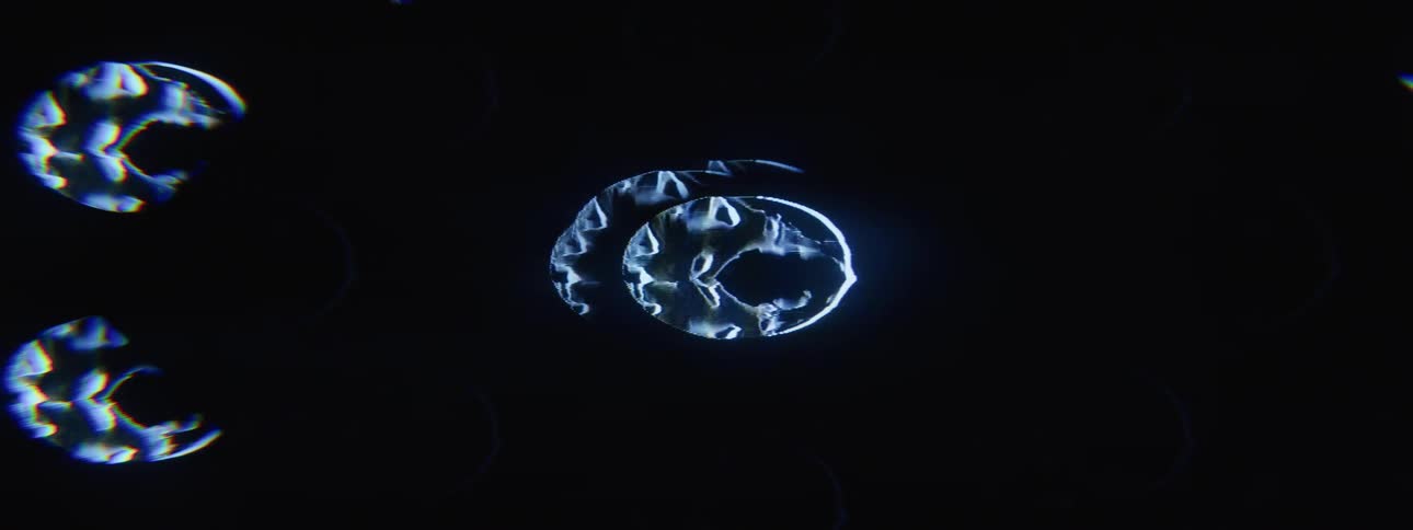 A closeup of a blue screen with distorted pulsating circular shapes