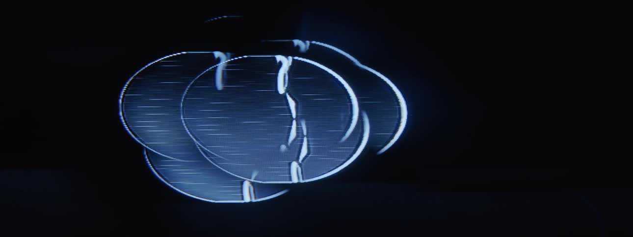 A bright blue abstract object with blue movements on its surface