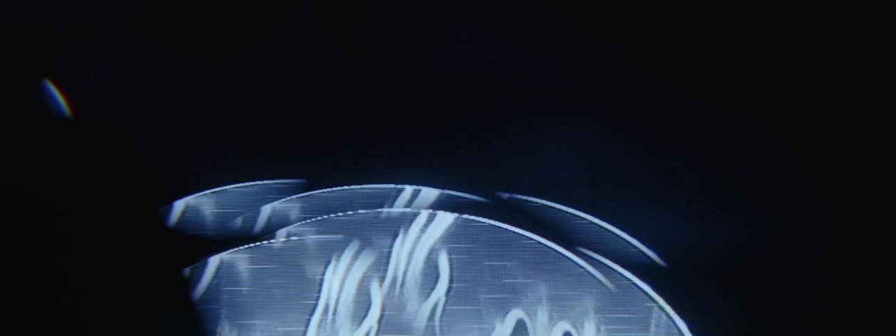 A bright blue beam of light rising on a black background