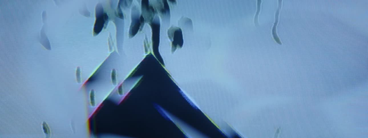 A footage of a shaky screen displaying a triangle