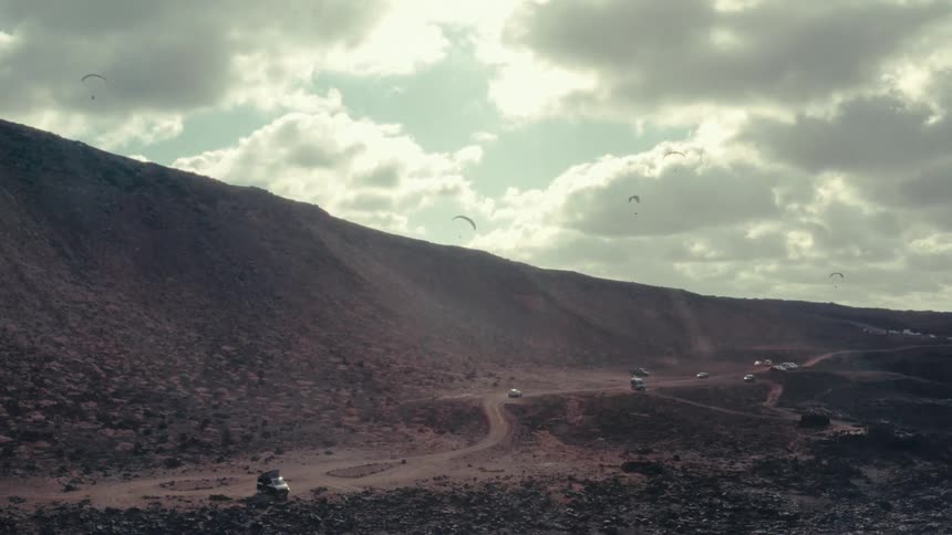 Cars racing on a rally through the desert