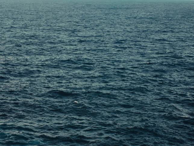 The rough blue waters have many ripples