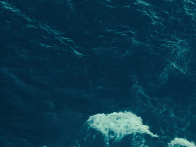 View from above of an ocean with moving waves