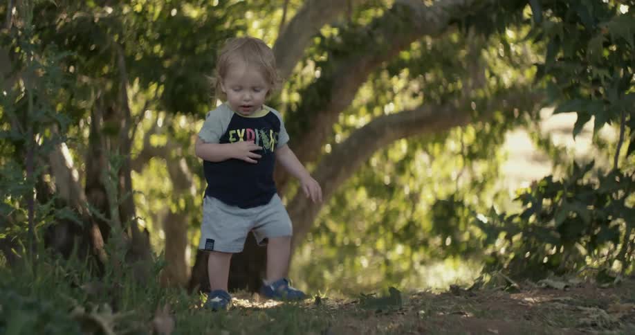 Baby walking through the forest