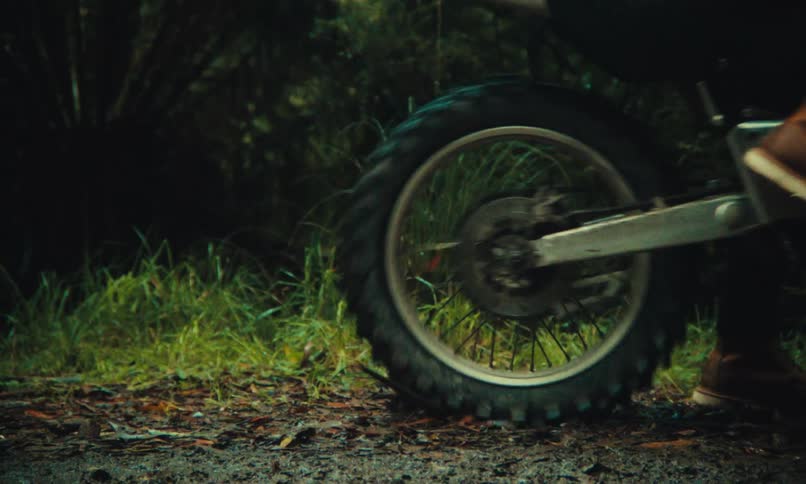 A person rides off on his dirt bike