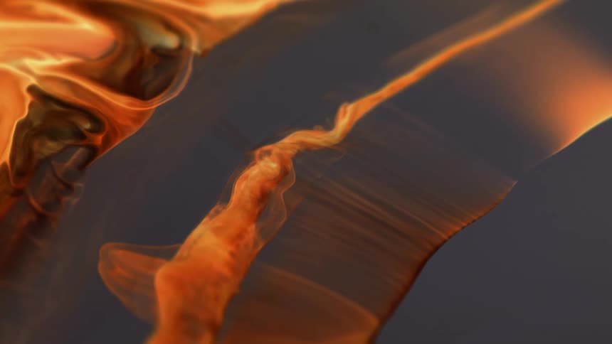 Waves of a bright yellow liquid or smoke waving against a dark background