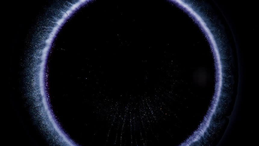 Circular abstract glow expanding against a black background