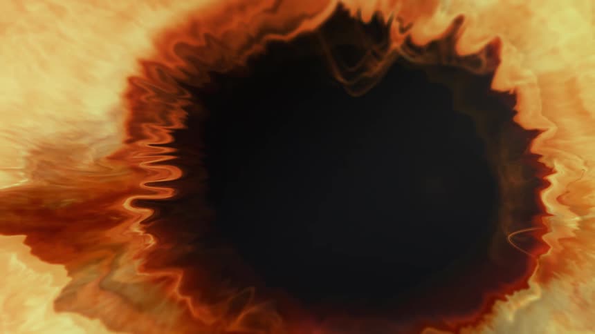 Close up of a bright yellow liquid contracting like an iris
