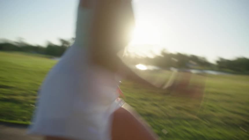 Woman in a park running and warming up with a footwork ladder