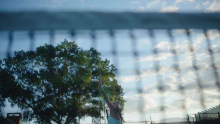 A woman is playing a game of tennis