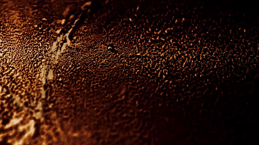 Extreme closeup on an abstract brown colored object with wear