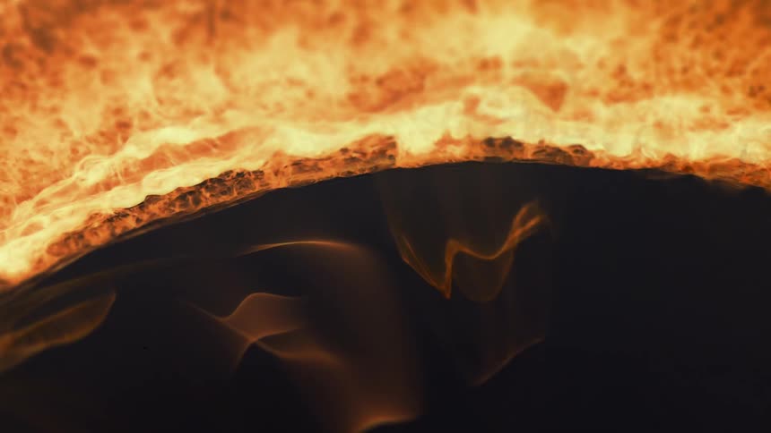 Flames with intense shades of orange and expanding into a black hole