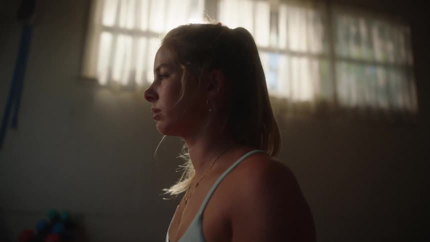 A teenage girl looking contemplative in a room