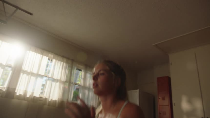 Woman jumping and squatting in functional cardio movement