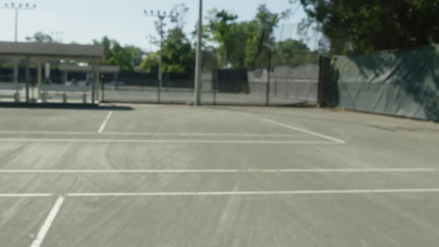 A player hits a tennis ball with their racket