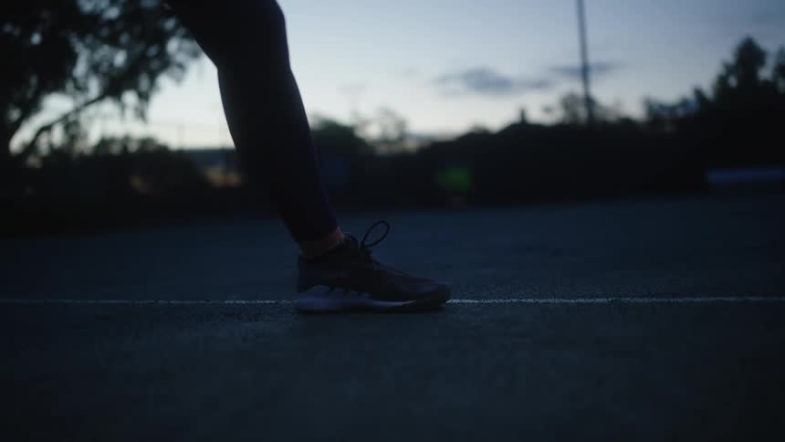 Someones foot while they do warm up stretches before exercising